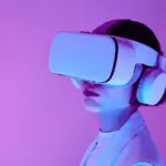 Woman explores virtual reality with VR goggles in modern studio light.