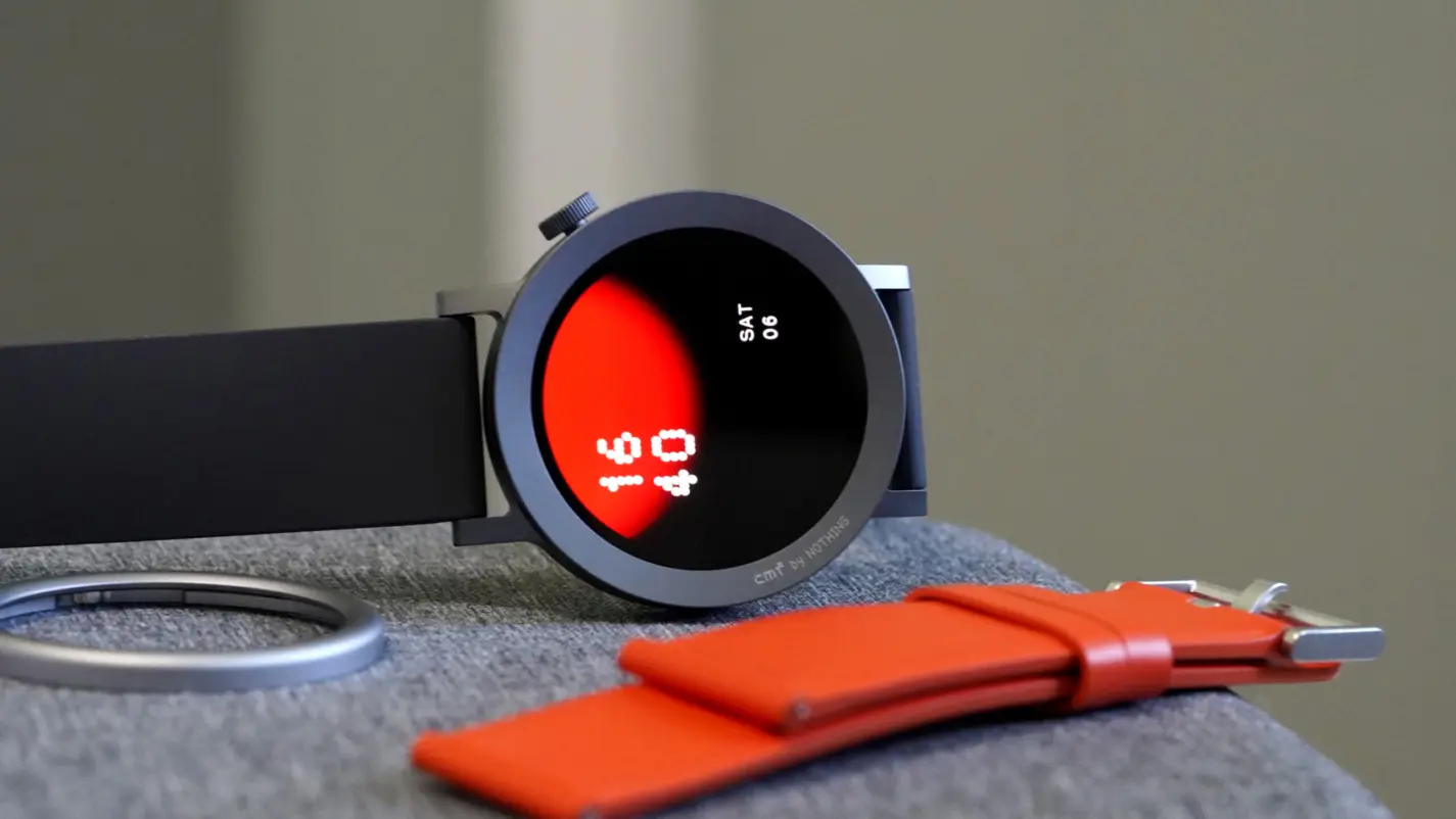 A CMF Watch Pro 2 by Nothing rests on its side, displaying a native watch face.